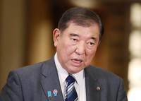Japanese Prime Minister Shigeru Ishiba speaks to reporters on Japan-U.S. tariff negotiations at his official residence in Tokyo on Saturday.