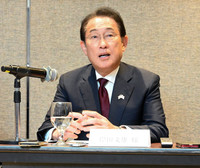 Former Japanese Prime Minister Fumio Kishida holds a press conference after meeting with Malaysian Prime Minister Anwar Ibrahim in Kuala Lumpur on Tuesday.