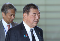 Prime Minister Shigeru Ishiba enters the prime minister's office in Tokyo on Wednesday.