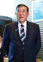 Japanese Prime Minister Shigeru Ishiba speaks about a weekly magazine report at the prime minister's office in Tokyo on Thursday.