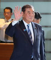 Japanese Prime Minister Shigeru Ishiba enters the prime minister's office in Tokyo on Friday.