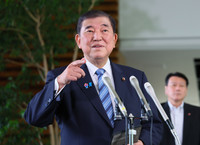 Japanese Prime Minister Shigeru Ishiba speaks to the press after a phone meeting with U.S. President Donald Trump at the prime minister's office in Tokyo on Friday.