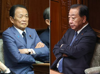 Taro Aso of Japan's ruling Liberal Democratic Party (left) and Yoshihiko Noda, leader of the main opposition Constitutional Democratic Party of Japan