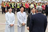 Japanese Emperor Naruhito (front 2nd right), Empress Masako (front 2nd left), and their daughter, Princess Aiko, (front left) depart for Okinawa Prefecture from Haneda Airport in Tokyo on Wednesday morning.