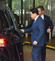 Japanese economic revitalization minister Ryosei Akazawa heads for talks with U.S. Commerce Secretary Howard Lutnick in Washington on Thursday.