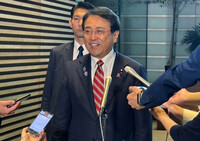 Japanese chief tariff negotiator Ryosei Akazawa speaks to reporters at the prime minister's office in Tokyo on Monday.