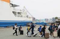 Evacuees from Akusekijima arrive at Kagoshima Port aboard a ship on Friday.