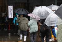 People line up for stockpiled rice at a home improvement store in Sendai, Miyagi Prefecture, northeastern Japan, on May 31.
