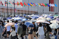 Crowds of people head to the venue of the World Exposition in the western Japan city of Osaka on Saturday.