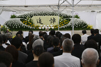 A memorial ceremony is held at the former site of Kyoto Animation's No. 1 studio in the city of Kyoto on Friday. (Courtesy of the company)