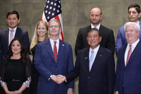 Japanese Prime Minister Shigeru Ishiba shakes hands with U.S. Treasury Secretary Scott Bessent in Tokyo on Friday.