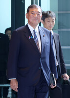 Japanese Prime Minister Shigeru Ishiba enters the prime minister's office in Tokyo on Wednesday morning.