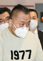 Tomonobu Kojima arrives at Tokyo's Haneda Airport in February 2023 after being deported from the Philippines.