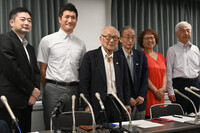Members of three Japanese organizations working for the abolition of nuclear weapons unveil a joint appeal in Tokyo on Wednesday.