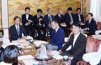 Economic revitalization minister Ryosei Akazawa (far right)  attends a meeting of senior members of the House of Representatives' Budget Committee on Friday.
