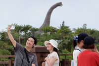 Visitors to Junglia Okinawa, an amusement park in Okinawa Prefecture, on July 25